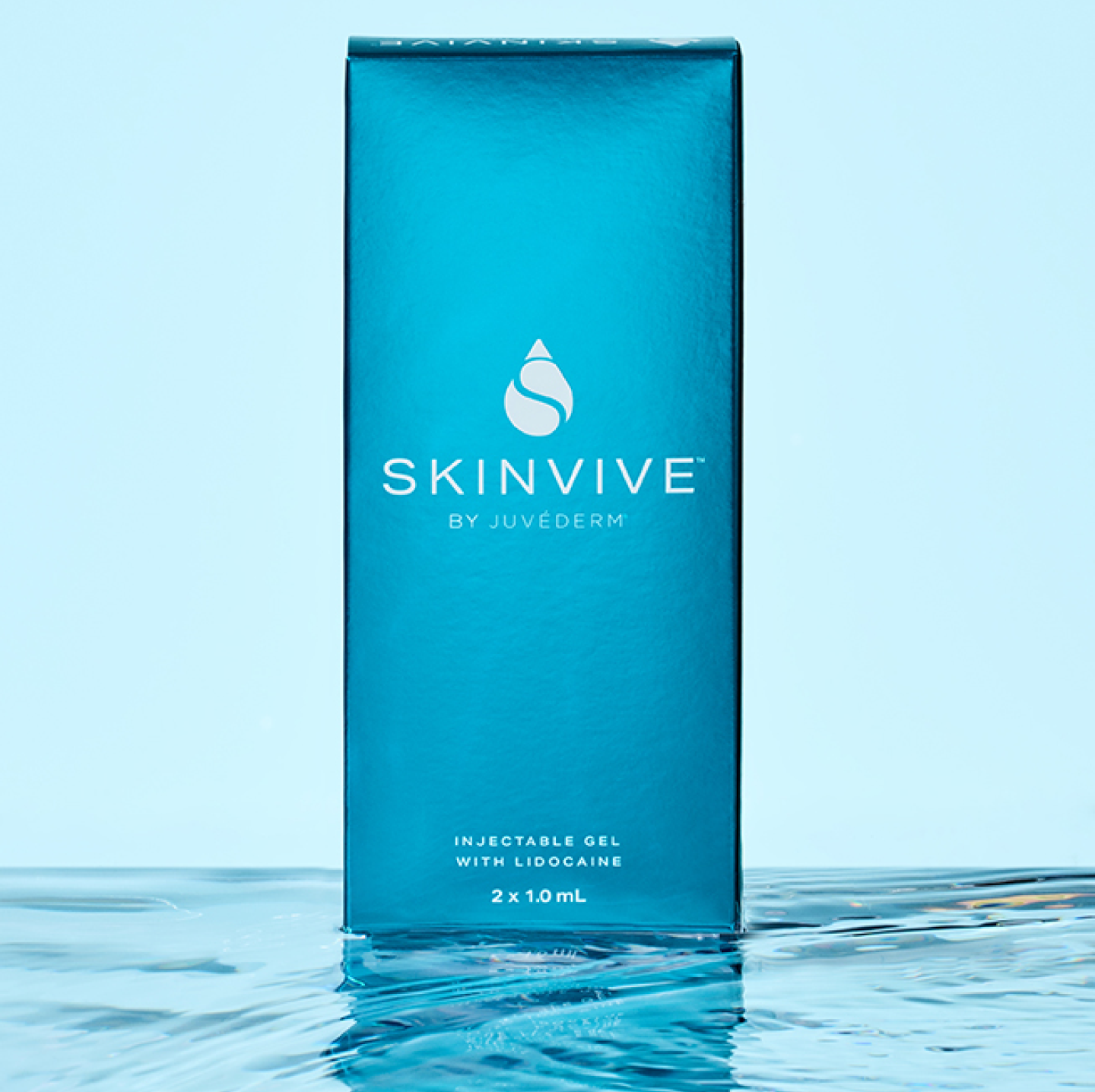 A SKINVIVE™ box standing upright in a puddle of water.